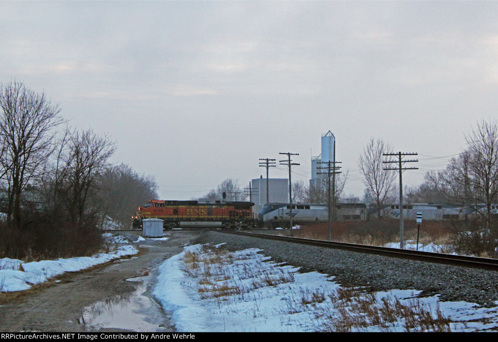 The eastbound 'Builder hammers over the CN with a pumpkin leader